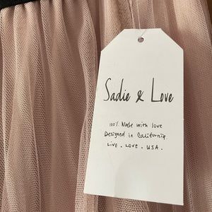 Brand new! Super cute light pink skirt with pearl embellishments.